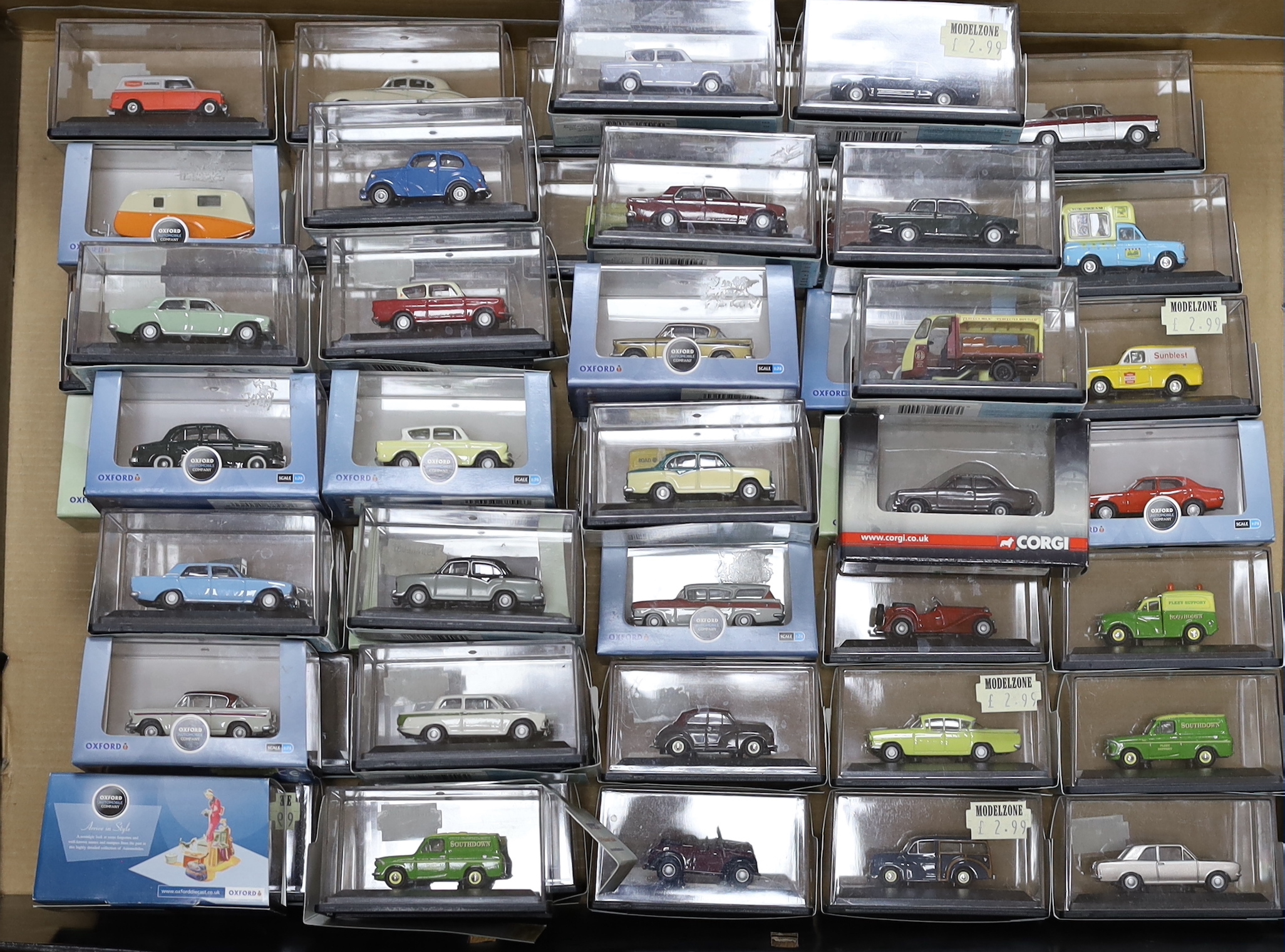 A collection of boxed 00 gauge 1:76 scale vehicles by Oxford Diecast and Corgi, including mainly 1950s/60s/70s cars and light commercial vehicles (54)